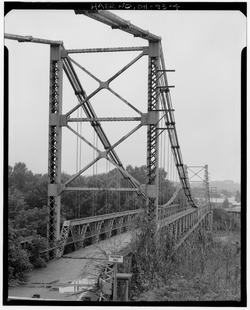 PERSPECTIVE VIEW OF BRIDGE FROM EAST END - Dresden Suspension Bridge, Spanning Muskingum River on State Route 208, Dresden, Muskingum County, OH HAER OHIO,60-DRES,1-4.tif