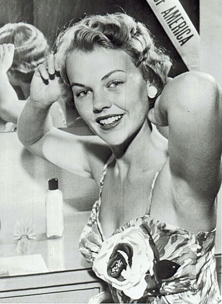 Carlene Johnson combing hair (cropped)