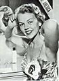 Carlene Johnson combing hair (cropped)