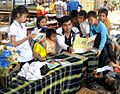 Khamla Panyasouk of Big Brother Mouse reads to children
