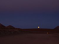 Moonrise above the 12 metres wide access road to the ALMA High Site