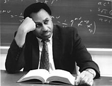 Ronald Mallett at his desk reading.jpg