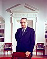 Lyndon B. Johnson, photo portrait, leaning on chair, color