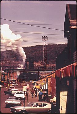 STREET IN CLAIRTON, PENNSYLVANIA, 20 MILES SOUTH OF PITTSBURGH. IN THE BACKGROUND IS A PORTION OF A COKE PLANT OWNED... - NARA - 557224.jpg