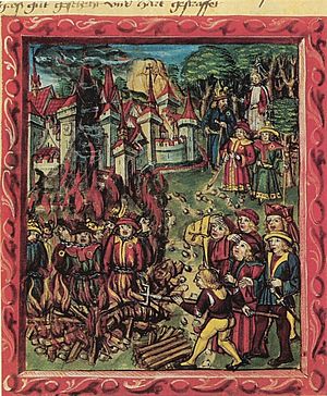 Archivo:Medieval manuscript-Jews identified by rouelle are being burned at stake