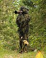 Wildlife Photographer Giles Laurent in a ghillie suit