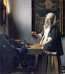 Archivo:Woman-with-a-balance-by-Vermeer