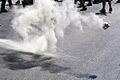 Exploded tear gas can on the fly