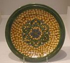 Earthenware dish with sancai glaze and rosette medallion, Tang Dynasty