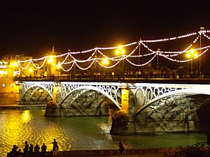Archivo:Velá de Santa Ana puente de Triana