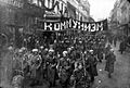 Armed soldiers carry a banner reading 'Communism', Nikolskaya street, Moscow, October 1917