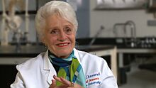 Marian-Smiling-in-lab-coat v1.jpg