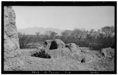 Historic American Buildings Survey John P. O'Neill, Photographer March 3, 1937 LOOKING NORTHEAST FROM SOUTHWEST CORNER OF PRINCIPAL STRUCTURE (Note Treasure Hunters' Holes) - HABS ARIZ,10-TUCSO,3-4