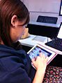 Woman playing Candy Crush Saga on iPad