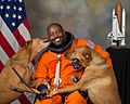 NASA astronaut Leland D. Melvin with his dogs Jake and Scout