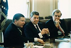 President Ronald Reagan receives the Tower Commission Report with John Tower and Edmund Muskie.jpg
