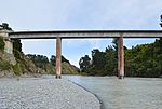 photo of a bridge high above over a river