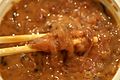 Ika no shiokara with chopsticks