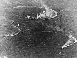 Japanese aircraft carrier Zuikaku and two destroyers under attack.jpg