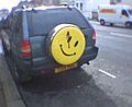 Watchmen smile on a jeep