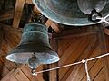 Campanas en lo alto de la torre de la iglesia de Santa María de Rilán. Chiloé. Chile