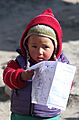 Curious look of sherpa child in Everest Base Camp route Nepal IMG 4165
