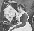 1877 Caroline S. Brooks and her sculpture in butter during a public exhibition at Amory Hall in 1877, from Robert N. Dennis collection of stereoscopic views