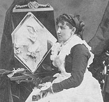 1877 Caroline S. Brooks and her sculpture in butter during a public exhibition at Amory Hall in 1877, from Robert N. Dennis collection of stereoscopic views.jpg