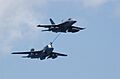 US Navy 060701-N-4776G-028 During air power demonstration, an F-A-18E Super Hornet assigned to Strike Fighter Squadron Twenty Two (VFA-22) performs an in-flight refueling with an EA-6B Prowler