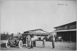 Townspeople of Ehrenburg, Ariz. Terr., greet a stranger in an automobile on his pioneer cross country tour. Saloon in ba - NARA - 513354.tif