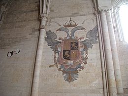 81 Monasterio de Palazuelos escudo emperador Carlos muro norte presbiterio ni