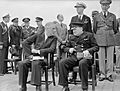 President Roosevelt and Winston Churchill seated on the quarterdeck of HMS PRINCE OF WALES for a Sunday service during the Atlantic Conference, 10 August 1941. A4815