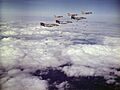 F-4B Phantoms of VF-161 and A-7C Corsairs of VA-86 drop bombs on Vietnam in March 1973