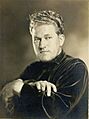 Studio portrait of August Derleth by Ephraim Burt Trimpey (cropped)