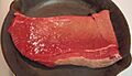 Beef round top round steak in pan, raw