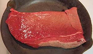 Archivo:Beef round top round steak in pan, raw