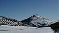 Cerro del castillo desde la ñora, nevado - panoramio (cropped)