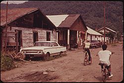 RAND, WV., WITH MUCH OF ITS POPULATION LIVING IN POVERTY, HAS MANY UNPAVED ROADS, SUBSTANDARD HOUSES, AND JUNKED... - NARA - 551001.jpg