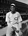 Satchel Paige seated next to bleachers (2)