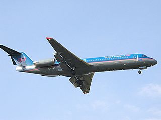 Bmi Fokker 100 (G-BXWF) landing at London Heathrow Airport.jpg