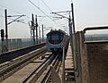 A Hyundai-Rotem coach of Delhi Metro's Pink Line at Mayur Vihar-I metro station