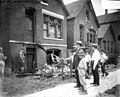 Chicago race riot, white men, boys standing in front of vandalized house