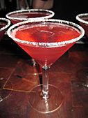 Lemon Drop Martini prepared with raspberry liquor and a sugared rim