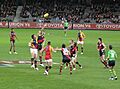 AFL match between Essendon (red and black) and Adelaide