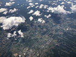 2019-07-19 13 09 19 View north across the town of Woodstock and northern Shenandoah County, Virginia from an airplane which recently took off from Washington Dulles International Airport.jpg