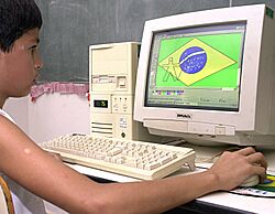 Brazilian boy drawing the Brazilian flag on Microsoft Paint.jpg