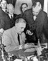 Franklin Roosevelt signing declaration of war against Germany