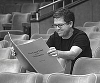 Archivo:John Powell with his Score (cropped, denoised)