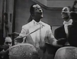 Archivo:Cee Pee Johnson (with unidentified musicians), performing his composition, "Beat My Blues Away," in Mystery in Swing (1940)