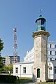 Restorated medieval lighthouse and modern radio tower